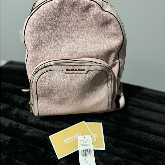 Michael Kors Handbags - Authentic Michael Kors large Jaycee Backpack in the Powder Blush/Monogram color